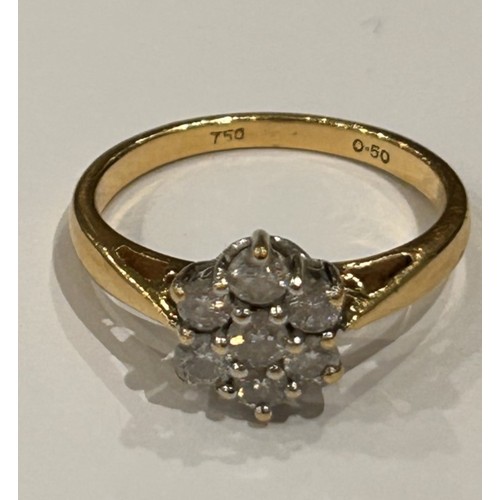 269 - 18ct gold diamond cluster ring in the form of a flower head, approx size L, 3.1g gross approximately... 