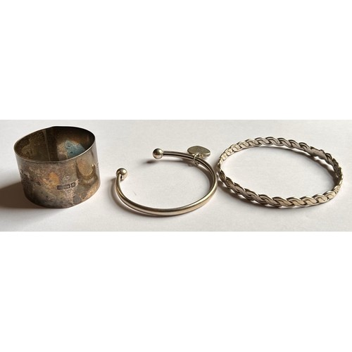 129 - Two Silver Bangles, Silver Necklace, Silver Napkin Ring & Silver Clogau Bracelet (5) 105.7g