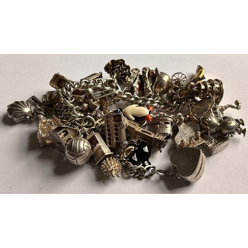 73 - A Silver Charm Bracelet & a collection of silver Charms - 315g (most stamped 925 or sterling)