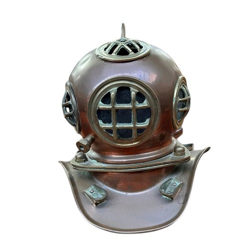 406 - A BRASS AND COPPER MODEL OF A DIVERS HELMET & copper figure of Divers finding sunken treasure (2)