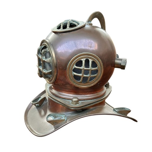 406 - A BRASS AND COPPER MODEL OF A DIVERS HELMET & copper figure of Divers finding sunken treasure (2)