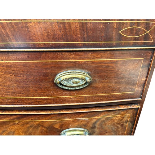 260 - A Regency style bow fronted mahogany cross banded chest of four long drawers