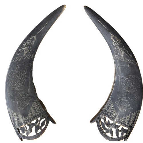 200 - a pair of carved buffalo horns (2) c. 28cm