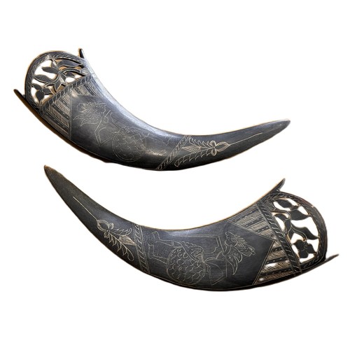 200 - a pair of carved buffalo horns (2) c. 28cm