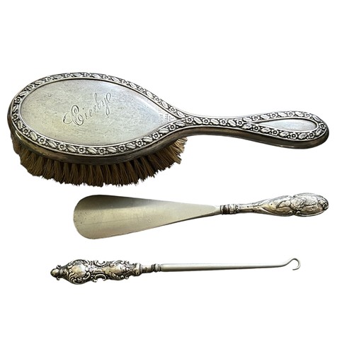 94 - Three Silver Items inc Dressing Table Brush, Silver Handled Shoe Horn & Silver Handled Crochet Hook ... 