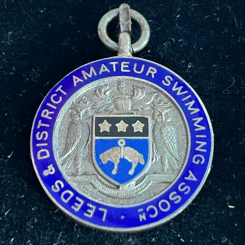 60 - Three Swimming / Water Polo Medallions (3) Two in 9ct Gold (4.2g, 4.2g) & one in Silver (11.8g) also... 