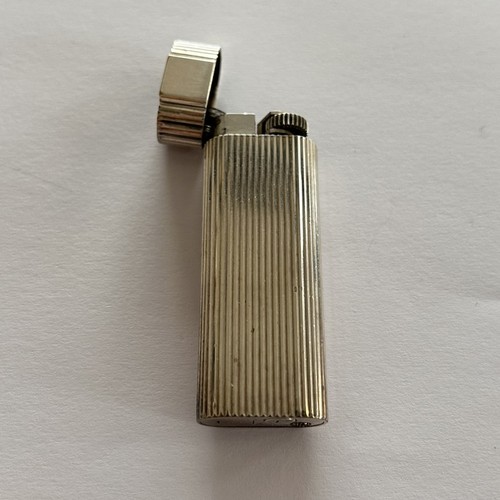 68 - Must de Cartier, engine turned pocket lighter with box, 7cm