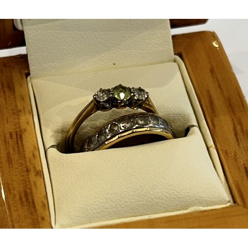 64 - Two 18ct Gold Rings (2), one set with a trio of stones 1.8g approx size L & an etenity ring 3.5g app... 