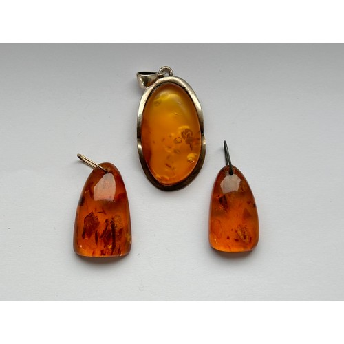 111 - Three Amber Pendants (3)