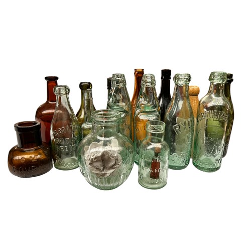 212 - Local Interest: A collection of antique glass bottles, inc two codd or marble glass bottles, Charles... 