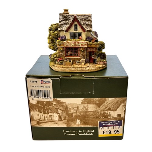 193 - Two Boxed Lilliput Lane cottages and a Phoenician Glass Paperweight (3)