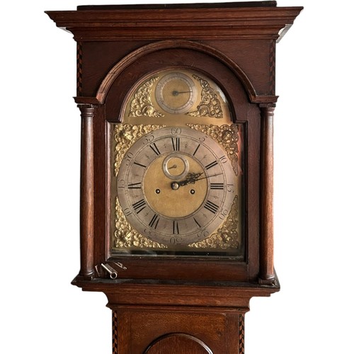 18 - An Oak Cased long case clock, arched brass dial with silvered chapter, subsidiary seconds and date a... 