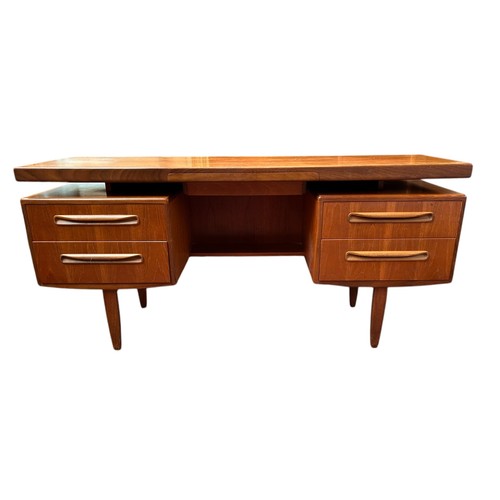 228 - A mid 20th century G-plan teak dressing table, 71cm h x 153cm w, together with a stool