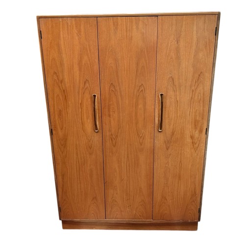 233 - A mid 20th century G-plan Fresco teak three door wardrobe