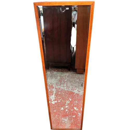 238 - A long Rowley Products Mid Century teak framed bevelled mirror. 33x94cm.