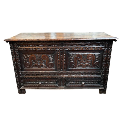 178 - A Carved Oak Blanket Box, probably made up of older panels
117cm wide x 70cm tall x 53cm deep