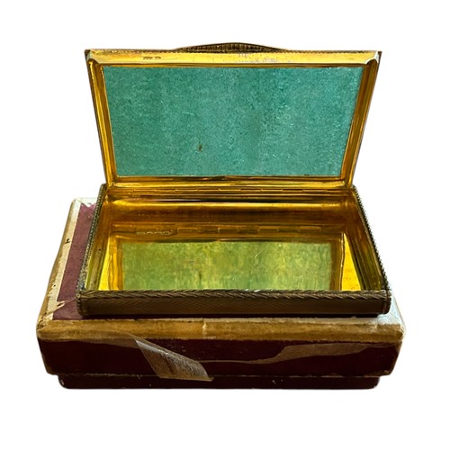 50 - A Hallmarked Silver Box, London 1927, probably a snuff box, allover engine turned design, gilt to in... 