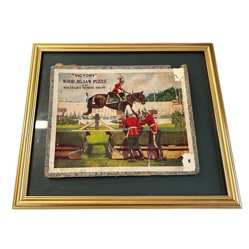 136 - Military Interest - A Framed Military Jigsaw Puzzle showing Sergeant East and his horse Victory at t... 