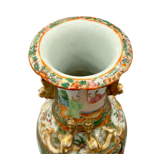 83 - A pair of 19th century Chinese Cantonese Famille Rose vases decorated with Chinese figures.