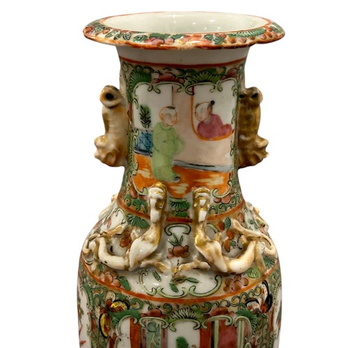 83 - A pair of 19th century Chinese Cantonese Famille Rose vases decorated with Chinese figures.