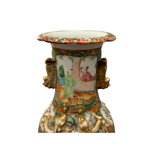 83 - A pair of 19th century Chinese Cantonese Famille Rose vases decorated with Chinese figures.