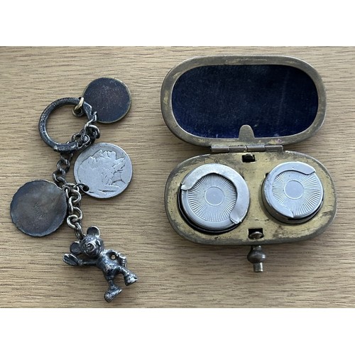 63 - A Small Silver Keyring with three additional charms (one a silver five Cents Buffalo Coin and anothe... 