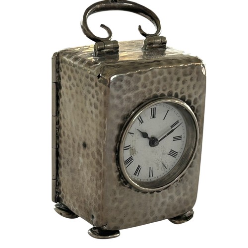 115 - A Small Hallmarked Silver Carriage Clock, eight day French movement in a beaten silver case, by Elki... 