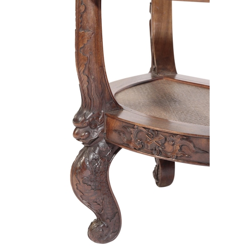 6 - RARE HUANGHUALI LOW ARMCHAIR, 17TH / 18TH CENTURY the horseshoe-shaped back with ornate dragon mask ... 