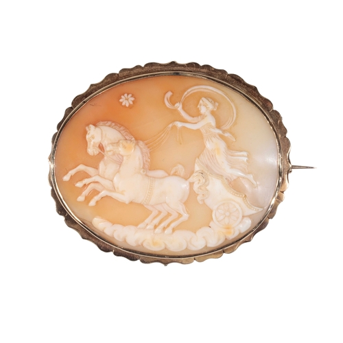 184 - A VICTORIAN CAMEO BROOCH the oval shell cameo of a maiden riding in a two-horse chariot, in an unmar... 