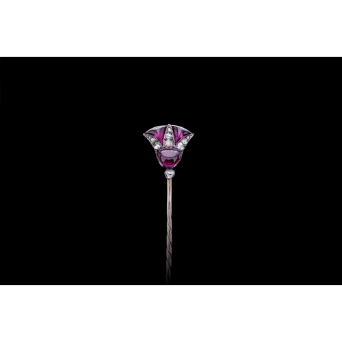 189 - A VICTORIAN THISTLE STICK PIN SET WITH AMETHYST AND DIAMOND in silver on gold. Estimated total diamo... 