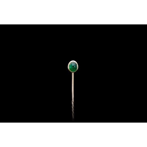 190 - A CABOCHON EMERALD STICK PIN SET IN 18CT YELLOW GOLD on an 18ct yellow gold barley twist pin fitting... 