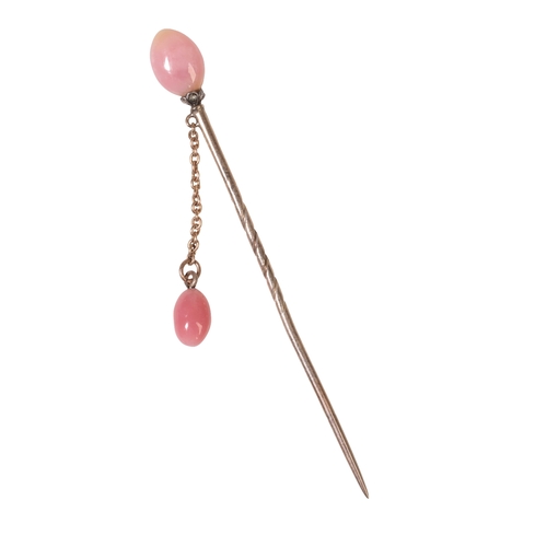 196 - AN EDWARDIAN CONCH PEARL STICK PIN mounted with diamonds on gold, with a chain link to a second conc... 