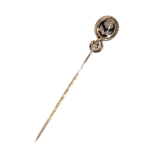 197 - A GEORGIAN SNAKE AND FLOWER MOURNING STICK PIN with an egg shaped panel of black enamel with a gold ... 