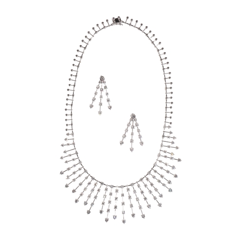 203 - A MODERN DIAMOND AND WHITE GOLD NEGLIGEE NECKLACE WITH EN SUITE EARRINGS, the one hundred and eleven... 