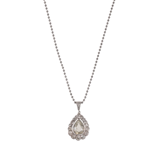 215 - A DIAMOND PENDANT NECKLACE the pear-cut diamond, suspended in an openwork frame of rub-over set diam... 