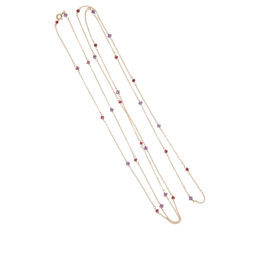 221 - A LONG SPECTACLE CHAIN SET WITH AMETHYST AND RUBY set in 18ct yellow gold, 56cm long