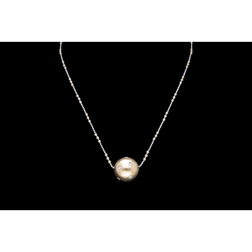 227 - A VINTAGE 14CT YELLOW AND WHITE GOLD SPHERE NECKLACE SET WITH DIAMONDS beautifully faceted two tone ... 