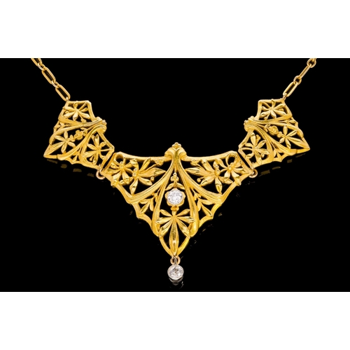 228 - AN ART NOUVEAU DIAMOND SET GOLD OPENWORK NECKLACE with an integrated chain set with spectacle set ro... 