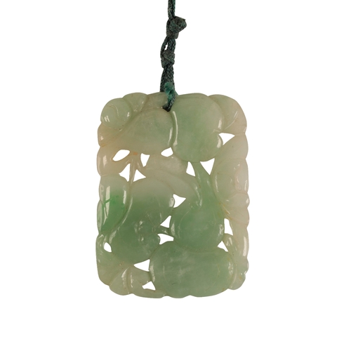 230 - A FINE CARVED JADEITE PENDANT depicting pomegranate fruits and gourds amongst foliage, the pendant 4... 