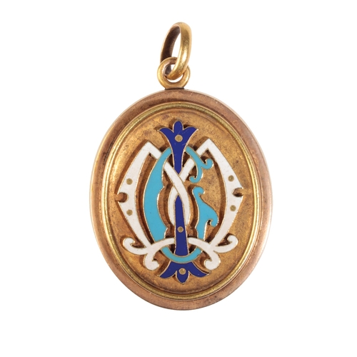 245 - A VICTORIAN  GOLD AND ENAMEL LOCKET the oval locket with an applied blue and white enamelled monogra... 