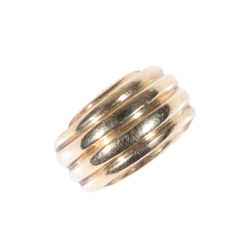 249 - A YELLOW GOLD  CHUNKY DRESS RING the polished ribbed band stamped 