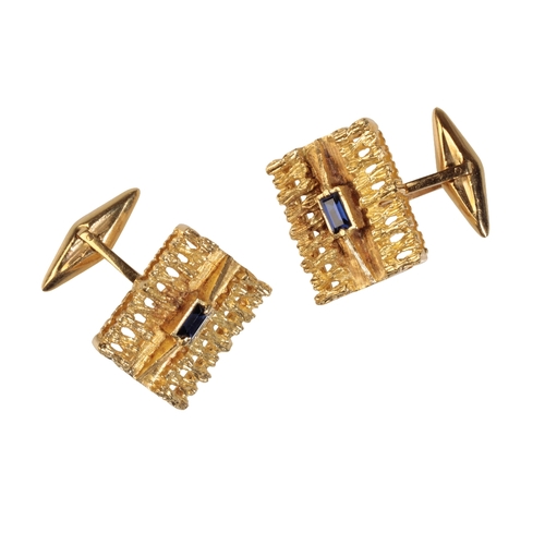 264 - A PAIR OF GENTLEMAN'S YELLOW GOLD CUFFLINKS each fancy openwork plaque, set to the centre with a sin... 