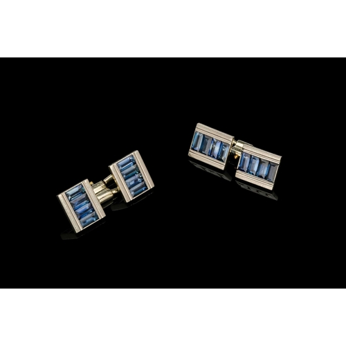 269 - A PAIR OF SAPPHIRE AND 18CT WHITE GOLD CUFFLINKS four rectangular plaques each set with baguette cut... 