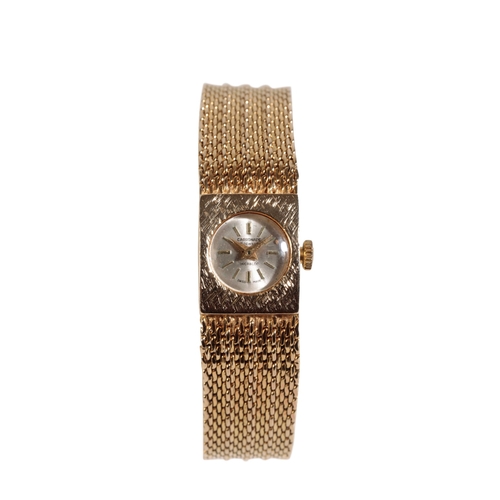 284 - CARRONADE LADY'S 9CT GOLD BRACELET WRISTWATCH with manual wind movement, the silver dial with gold b... 