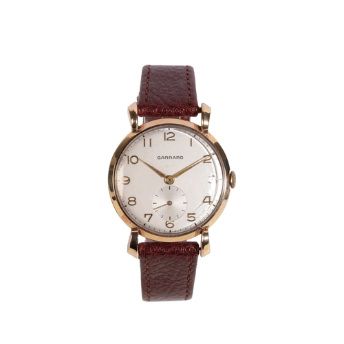 293 - GARRARD 9 CT GOLD GENTLEMAN'S WRIST WATCH with manual wind movement, the silver dial with subsidiary... 