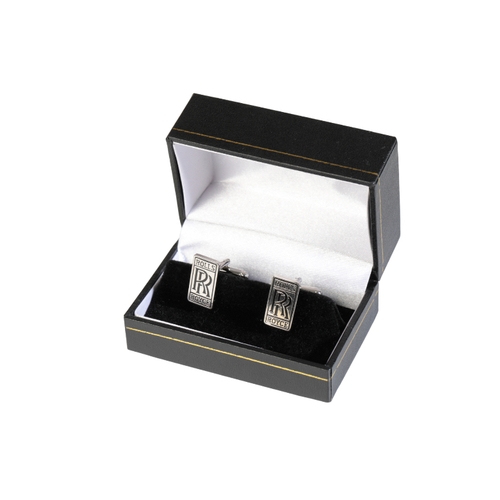 111 - A PAIR OF BENTLEY CUFFLINKS with silver plate and enamel Bentley crests, and a pair of Rolls Royce c... 