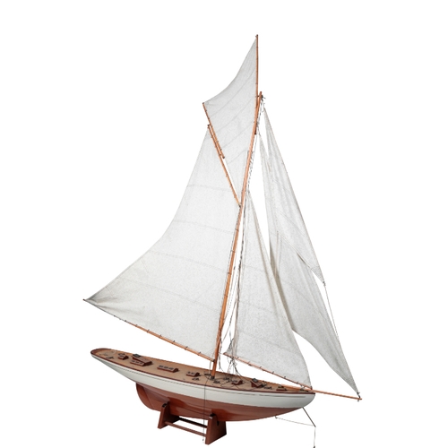 214 - A VINTAGE POND YACHT the sloop with a white painted hull and a large mainsail, the hull 120cm, and t... 