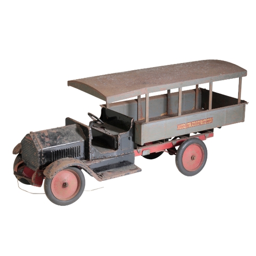 216 - A 1930'S TIN TOY TRUCK from the 'Sturditory Trucking Company', 66cm long. Provenance: The Estate of ... 