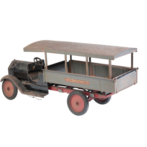 216 - A 1930'S TIN TOY TRUCK from the 'Sturditory Trucking Company', 66cm long. Provenance: The Estate of ... 