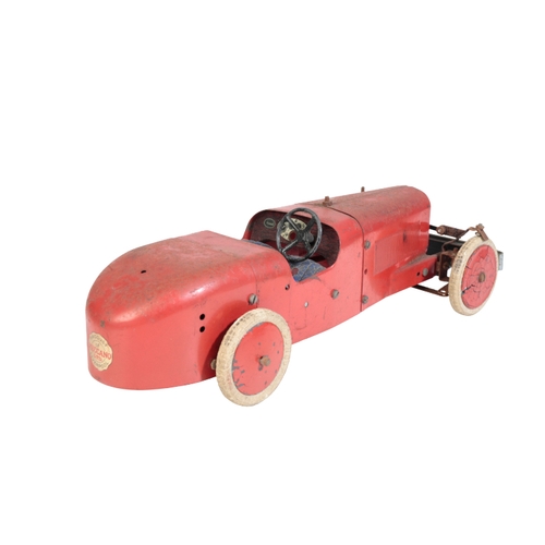 224 - A 1930'S MECCANO LTD RACING CAR tinplate with a clockwork motor, painted in red, 31cm long. Provenan... 